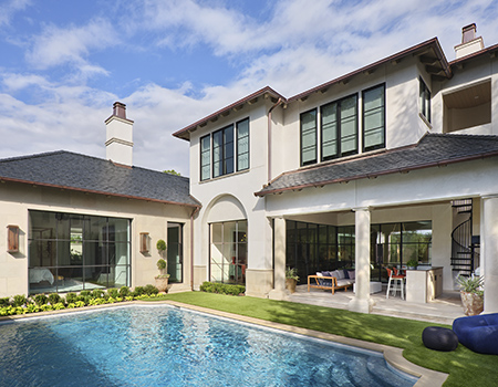 Custom home with beautiful backyard pool and water feature in Houston, TX